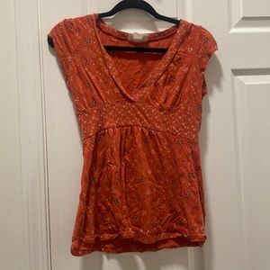 Juniors orange floral and stars top